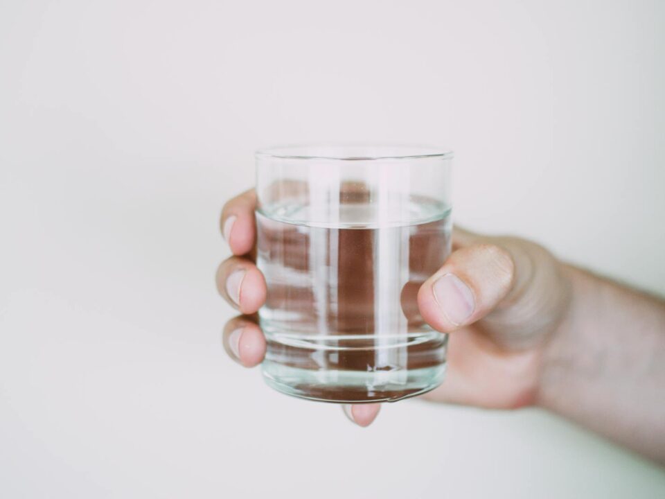 Person Holding Drinking Glass
