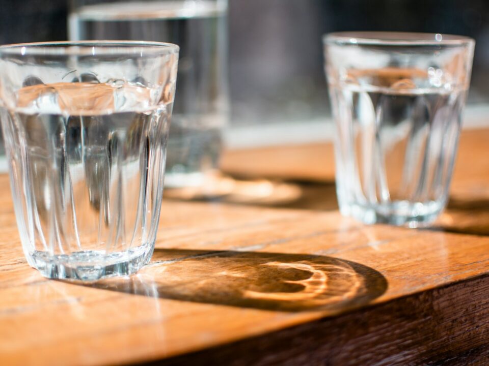 three clear drinking glass on table